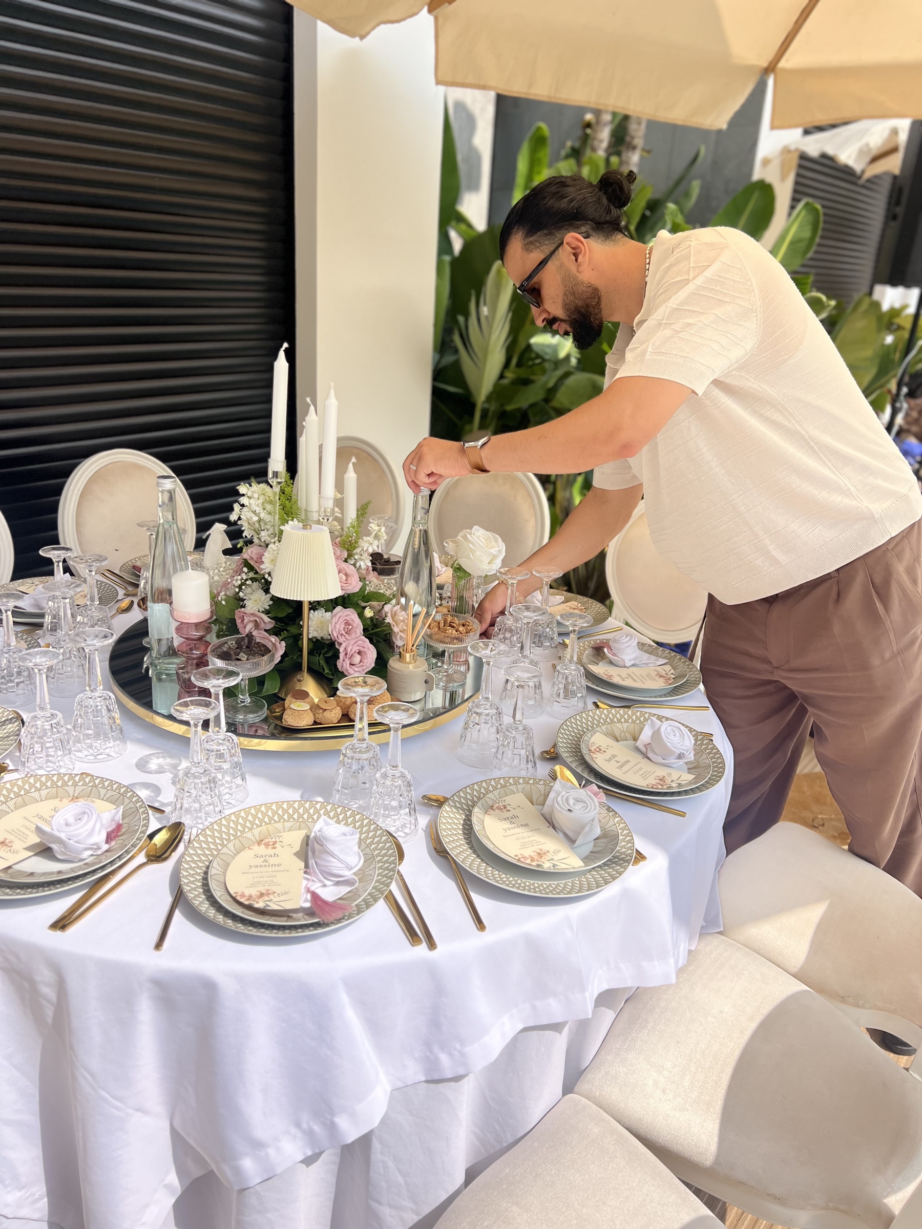 Med Adam Jabri overseeing table setup for an event